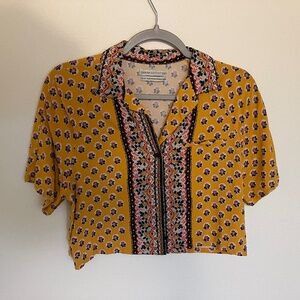 Urban Outfitters mustard yellow patterned crop top.